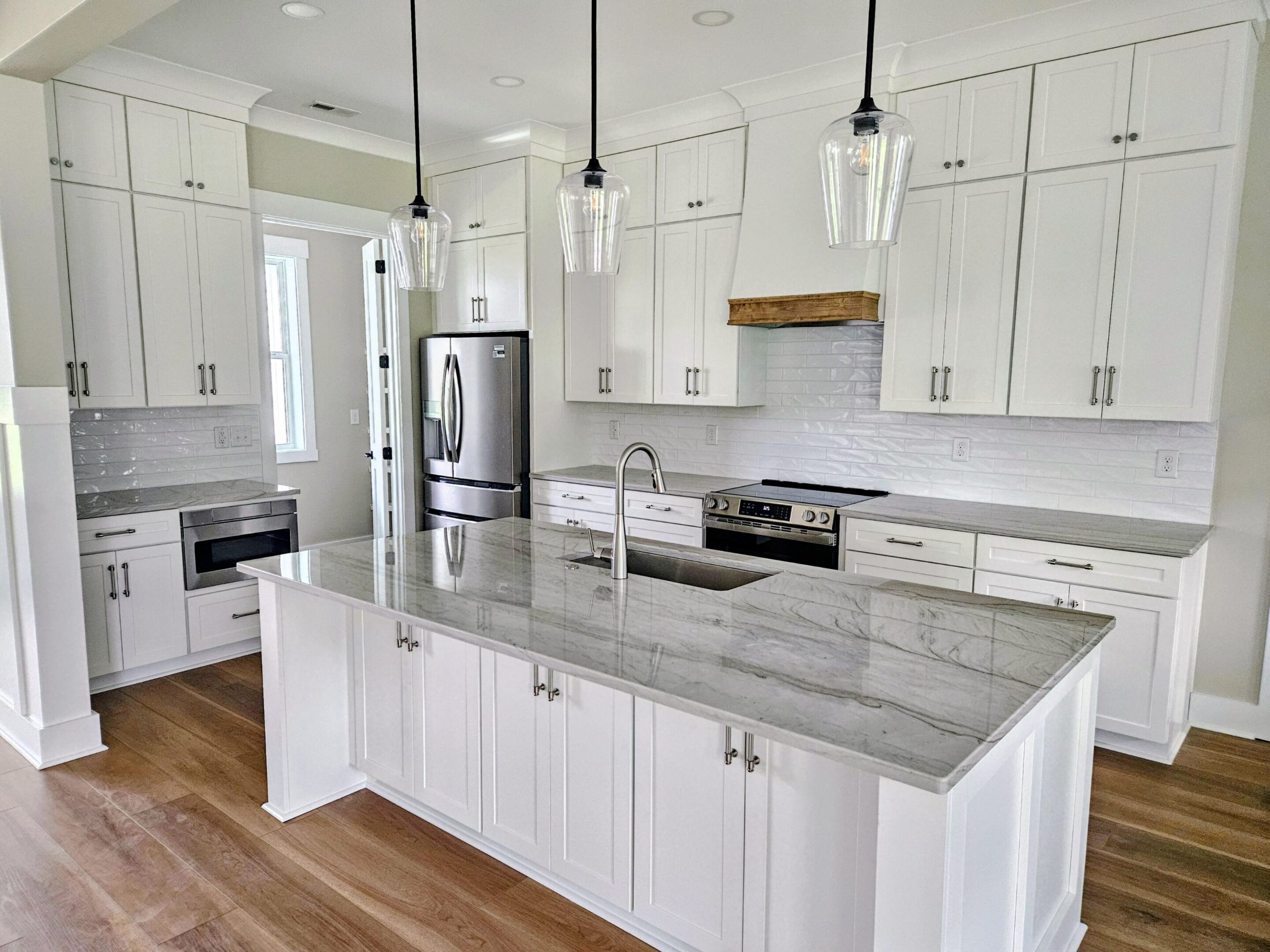 Bright modern kitchen with marble island