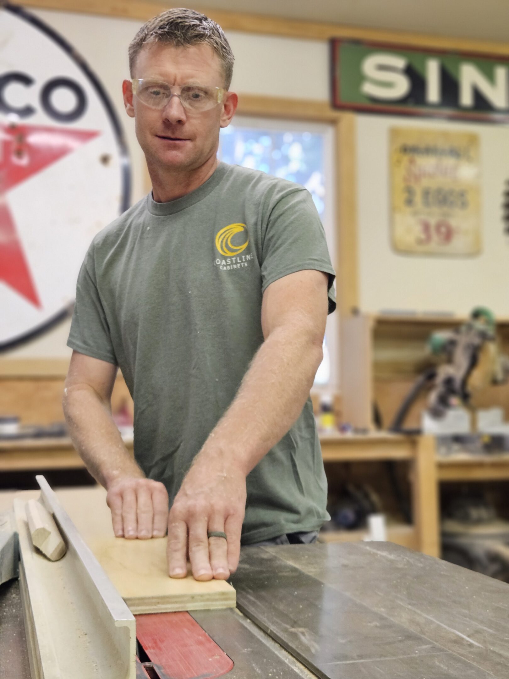 Woodworker using table saw in workshop