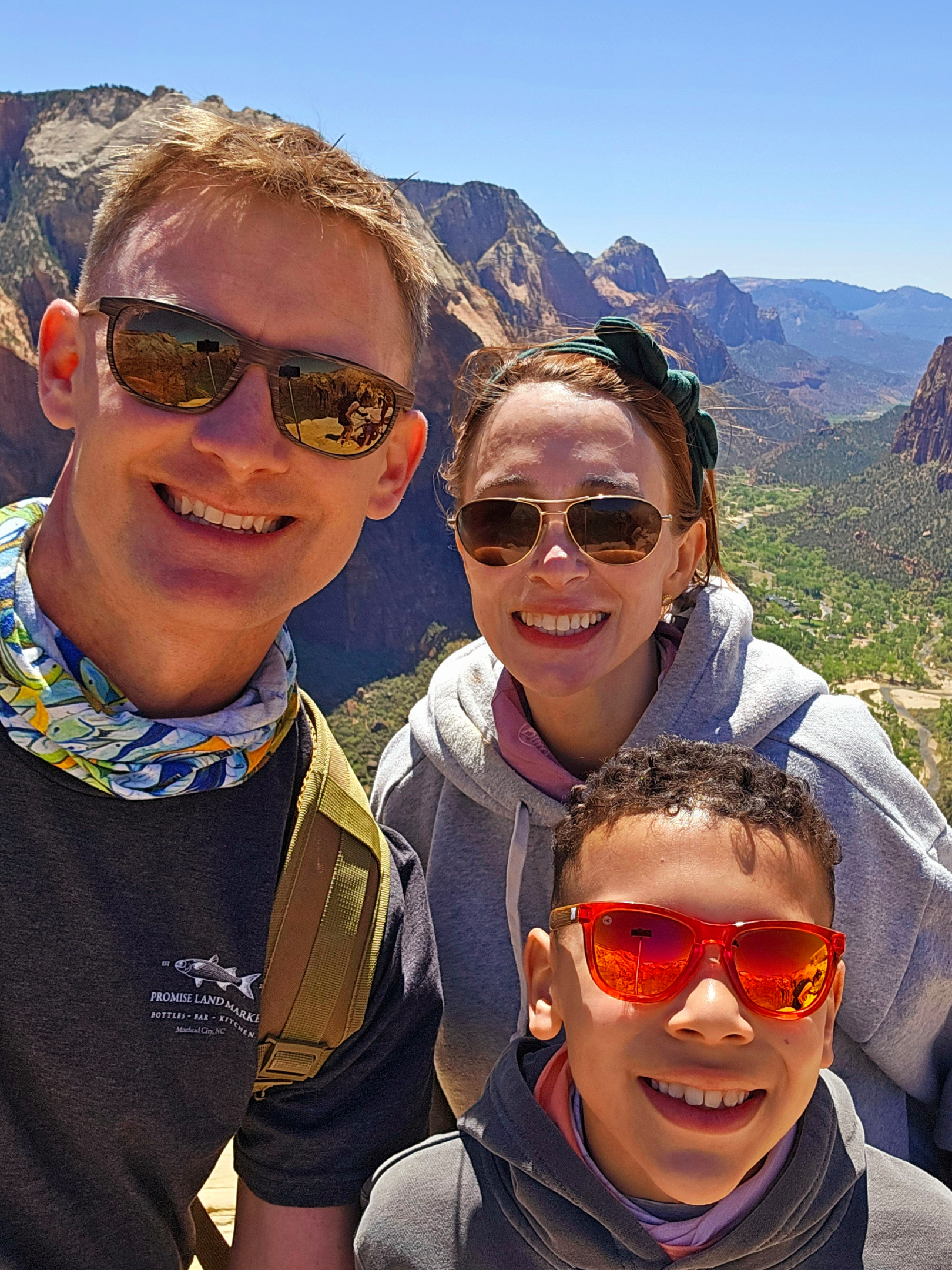 Family selfie at sunny canyon overlook