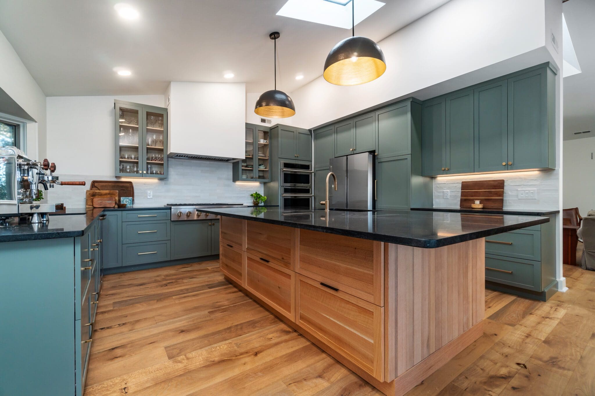 Modern kitchen with green cabinets