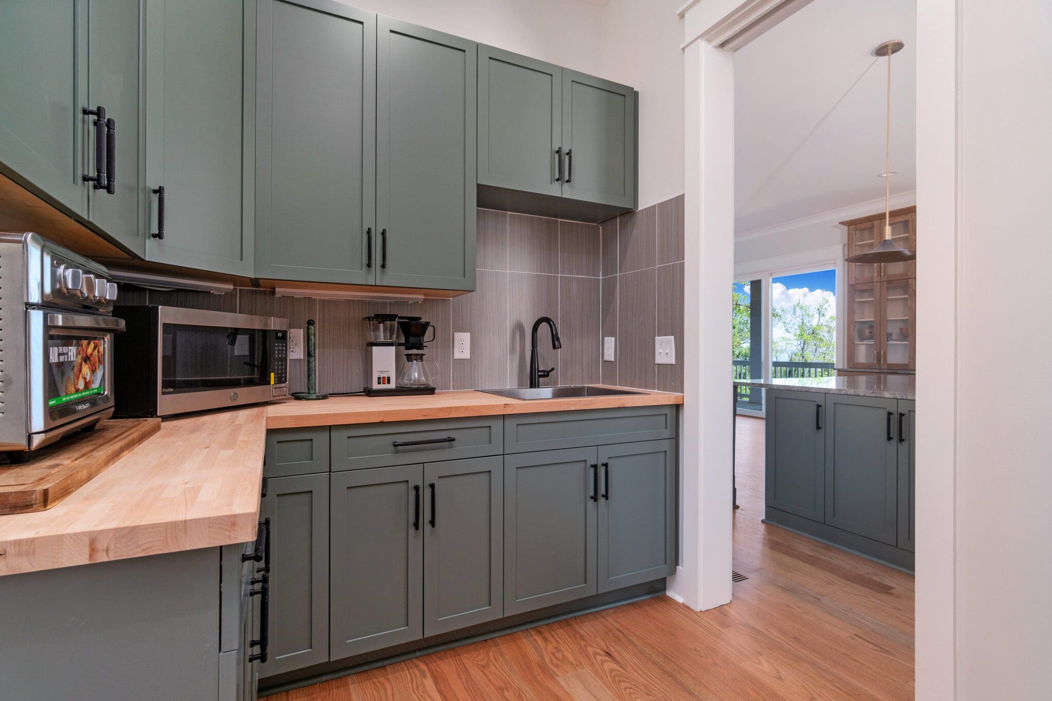 Modern kitchen with appliances and wooden floor