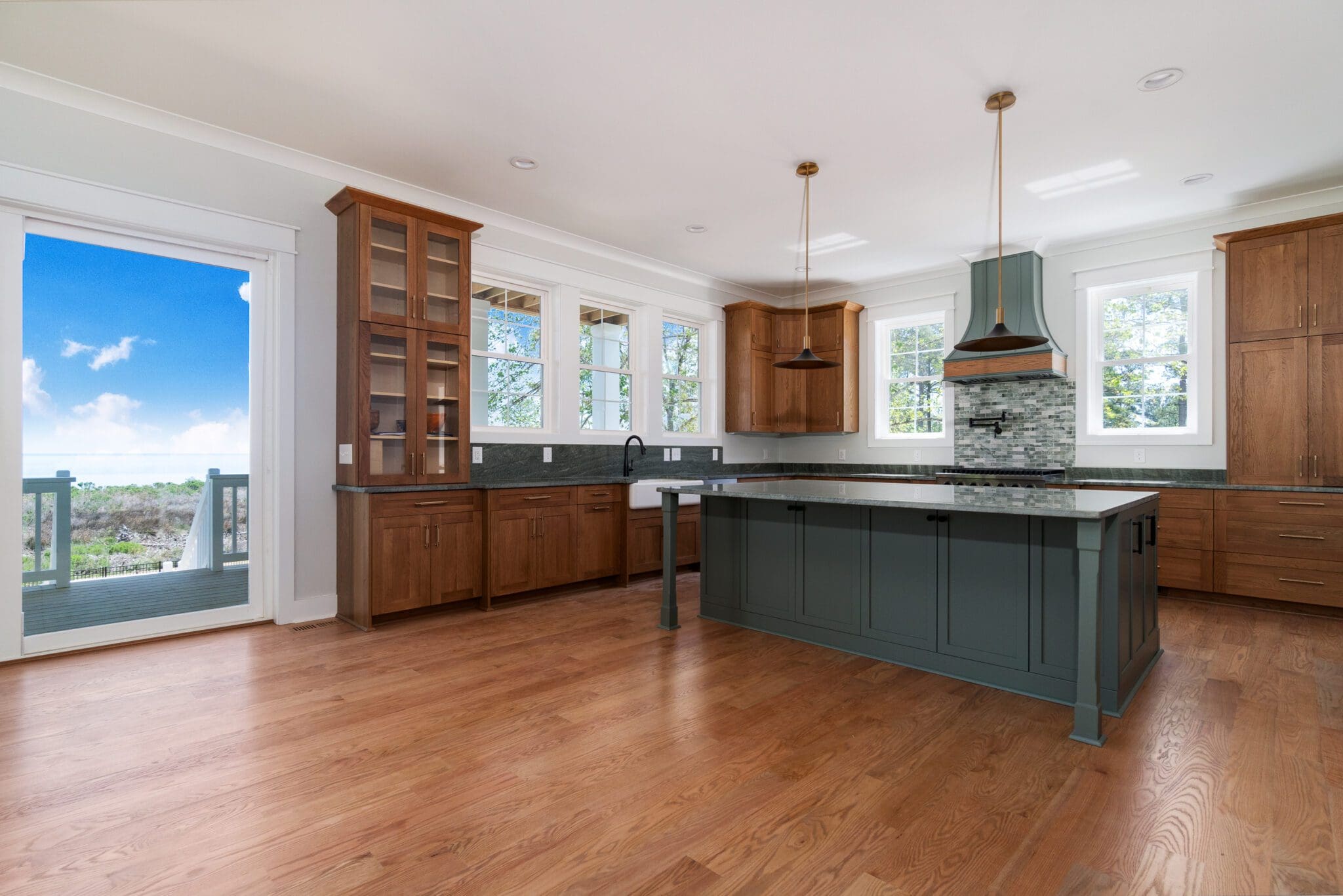 Modern kitchen featuring large windows and island